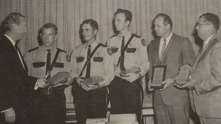 Ramiro Martinez and fellow officers receiving bravery award plaques in 1966